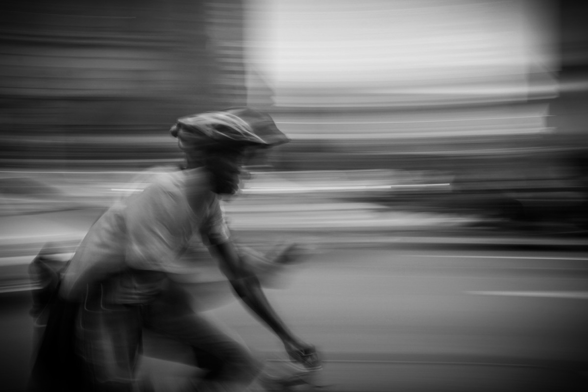 A cyclist moving through a city