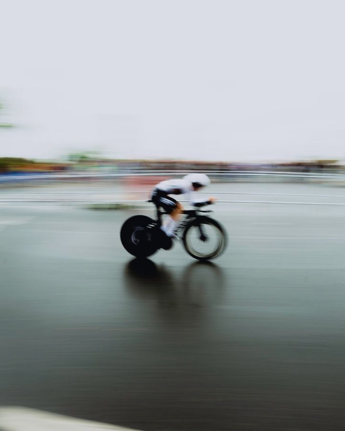A triathlete riding hard in the aero position